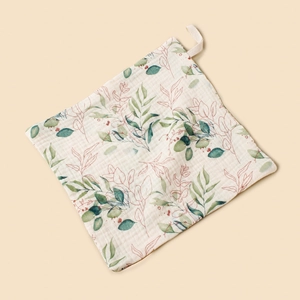 Soft cotton muslin baby washcloth with delicate green leaf pattern and hanging loop.
