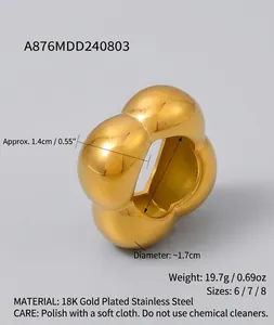 Detail view of wavy hollow flower ring in 18k gold plated steel showing 1.4cm width