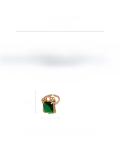 Macro shot of rectangular green zircon ring with gold copper band and side crystals