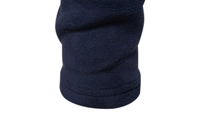 Detail of dark blue polar fleece fabric texture and double-stitched cuffs on the hoodie