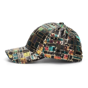 Close-up of colorful sequin patterns on a stylish outdoor baseball cap detail