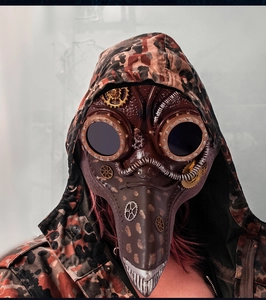 Steampunk plague doctor mask detail showing bronze gears, rivets and brown leather texture