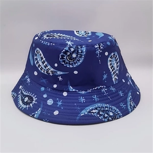 Detailed pattern of paisley leaf print on a deep blue reversible bucket sun hat