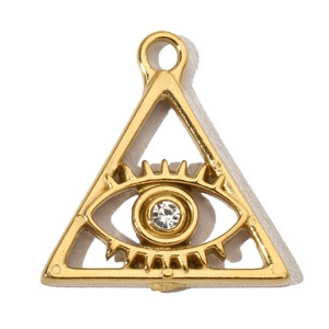 Macro shot of a golden triangle pendant with a sparkling zircon eye and polished finish