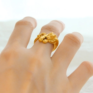 Golden titanium steel tiger ring with 3D carved design worn on finger for men and women