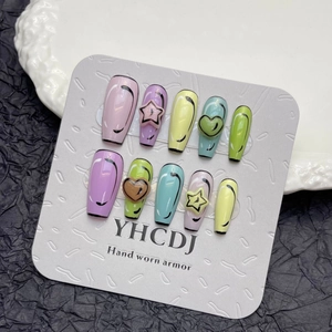 Handmade press-on nails with 3D hearts and stars in vibrant macaron colors