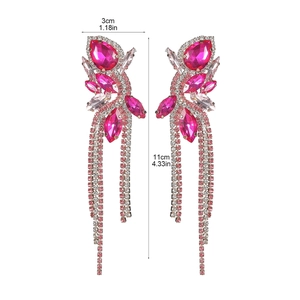 Macro shot of rose red tassel earrings with pear-shaped crystals and 11cm length measurement