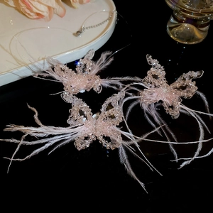 Dreamy pink feather and crystal butterfly sweater necklace for women with soft plush accents