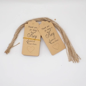 Brown kraft paper Thank You tags with heart detail and natural jute twine for gift packing