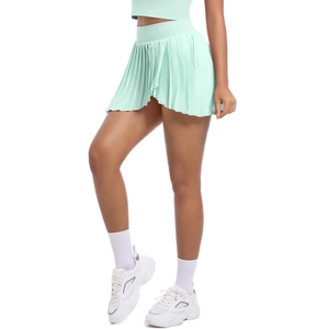 Detail of mint green pleated tennis skirt featuring side pocket and high waist cut