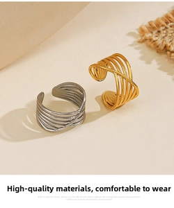 Detail showing multi-layer crisscross gold and silver plated stainless steel open rings