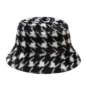 Thick plush houndstooth bucket hat for winter warmth with a soft faux fur finish