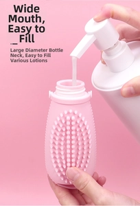 Close-up of filling white lotion into a pink silicone travel bottle with large opening
