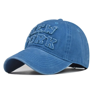 Close-up of vintage distressed navy baseball cap with NEW YORK applique embroidery