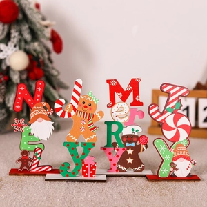 Close-up of festive wooden Christmas table decor with NOEL and MERRY letters and gnome figures