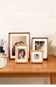 Detail of walnut and natural wood photo frames with traditional mortise tenon joints
