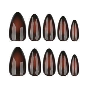 Glossy almond-shaped press-on nails featuring a black and brown ombre gradient finish