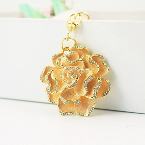 Sparkling rhinestone rose flower metal keychain in peach pink and champagne enamel finish
