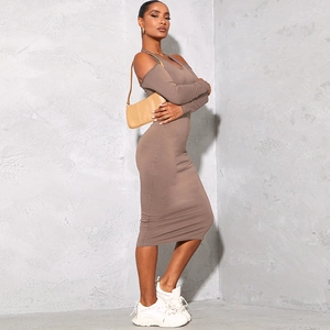 Chic mocha knit midi dress with halter neck and shoulder cut-out details on model