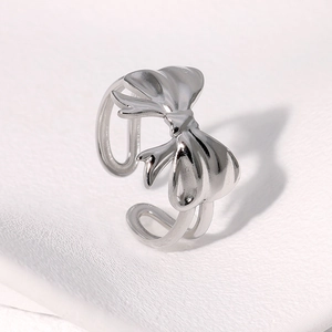 Minimalist silver bow knot stainless steel open ring with a polished metallic finish