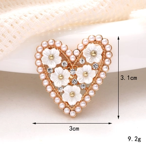 Golden heart-shaped brooch with white pearls, floral details and crystal rhinestones