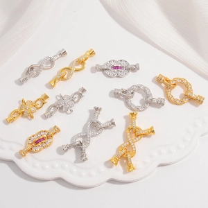 Macro detail of S925 silver lobster clasps with white and red zircon for DIY jewelry