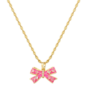 Detail of pink bow pendant necklace with sparkling zircons on golden twisted chain