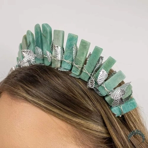 Detail of silver leaf crown with green crystal quartz on blonde hair