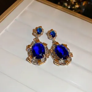 Luxurious vintage oval blue zircon drop earrings with gold and silver tone accents