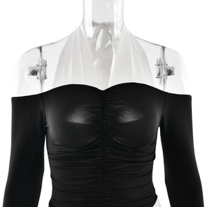 Detail of off-shoulder ruched dress with contrasting white halter tie and smooth texture