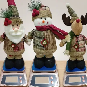 Detailed view of Santa, snowman, and reindeer plush dolls being weighed on a scale