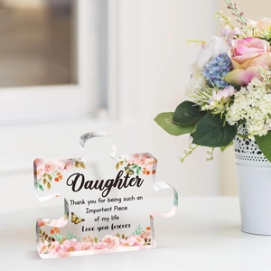 Close-up of heart-shaped acrylic puzzle ornament with pink roses and butterfly print