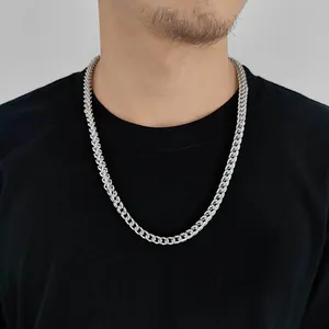 Close-up of 6mm silver stainless steel Franco chain necklace worn by a male model