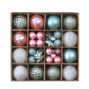 Detailed top view of a 16-grid gift box with assorted pink and blue Christmas ornaments