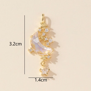 Detailed view of gold star and crescent moon pendant with embedded zircon crystals