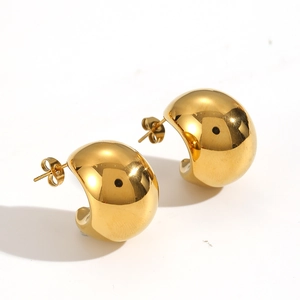 Polished golden C-shaped hoop earrings with a smooth metallic finish on white background