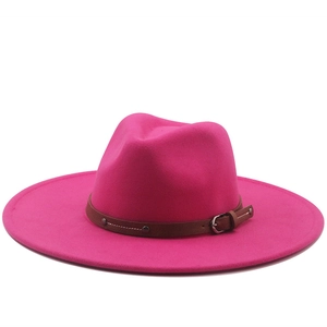 Detail of rose red fedora hat with 9.5cm wide brim and brown leather belt buckle