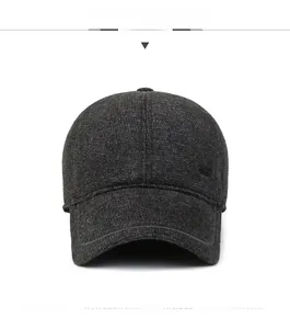 Detailed front view of a dark grey wool baseball cap with ear protection and metal logo