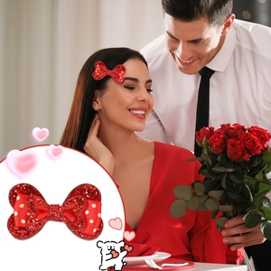 Detail showing red sequined bow hair clip with gold dots for festive romantic styling