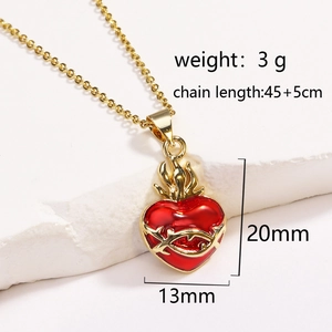 Detail of red heart pendant with gold thorn design showing 20mm height and 13mm width dimensions
