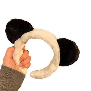Cute panda plush headband with black and white ears for face washing or makeup