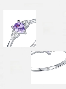 Macro shot of S925 sterling silver ring featuring a heart-shaped purple zircon stone