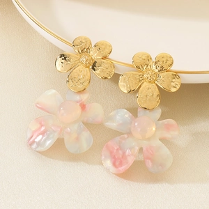 Detailed close-up of golden metal and pink gradient resin double flower drop earrings