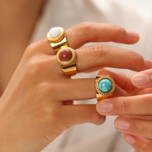 Retro 18K gold plated stainless steel rings with turquoise and natural stone worn by a model