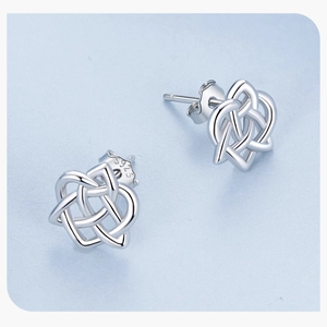 Detail view of S925 sterling silver Celtic knot earrings with hallmark and heart pattern