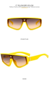 Detailed view of oversized yellow shield sunglasses with a gold star bridge ornament