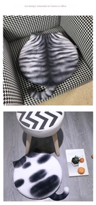 Detailed view of gray tabby and black spotted cat-shaped memory foam seat cushions with ears