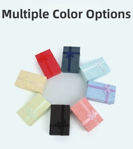 Variety of colorful jewelry gift boxes with ribbon bows and lychee texture finish
