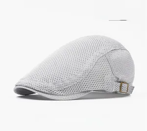 Detail view of the breathable mesh texture and adjustable metal buckle on this grey flat cap