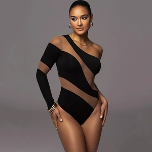 Detail view of a one-shoulder bodysuit with black and brown mesh patchwork design
